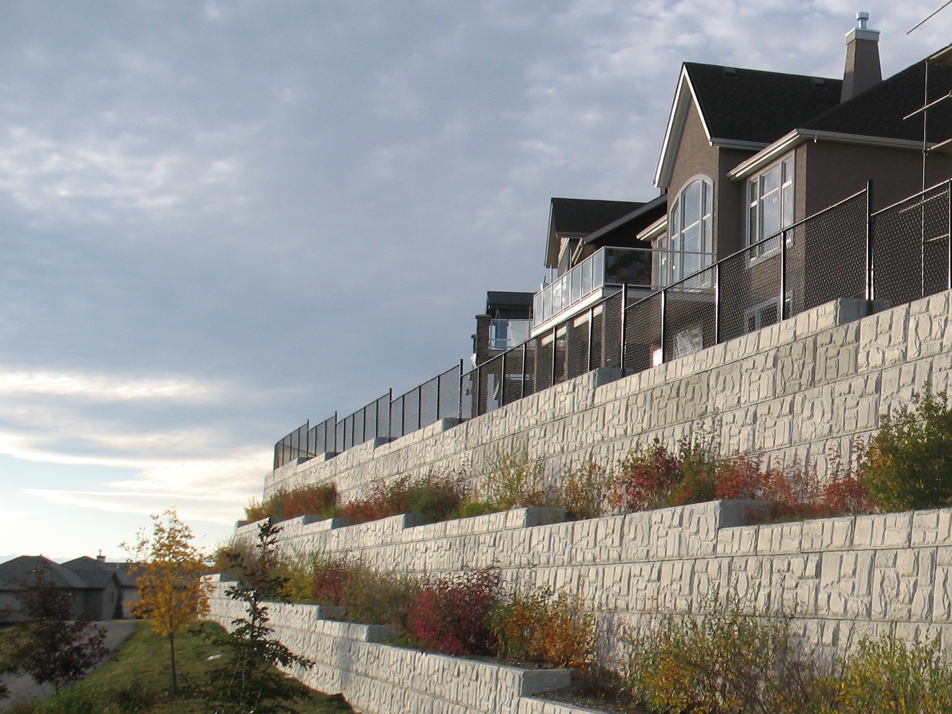 Multi-tier retaining wall holding up a hillside property